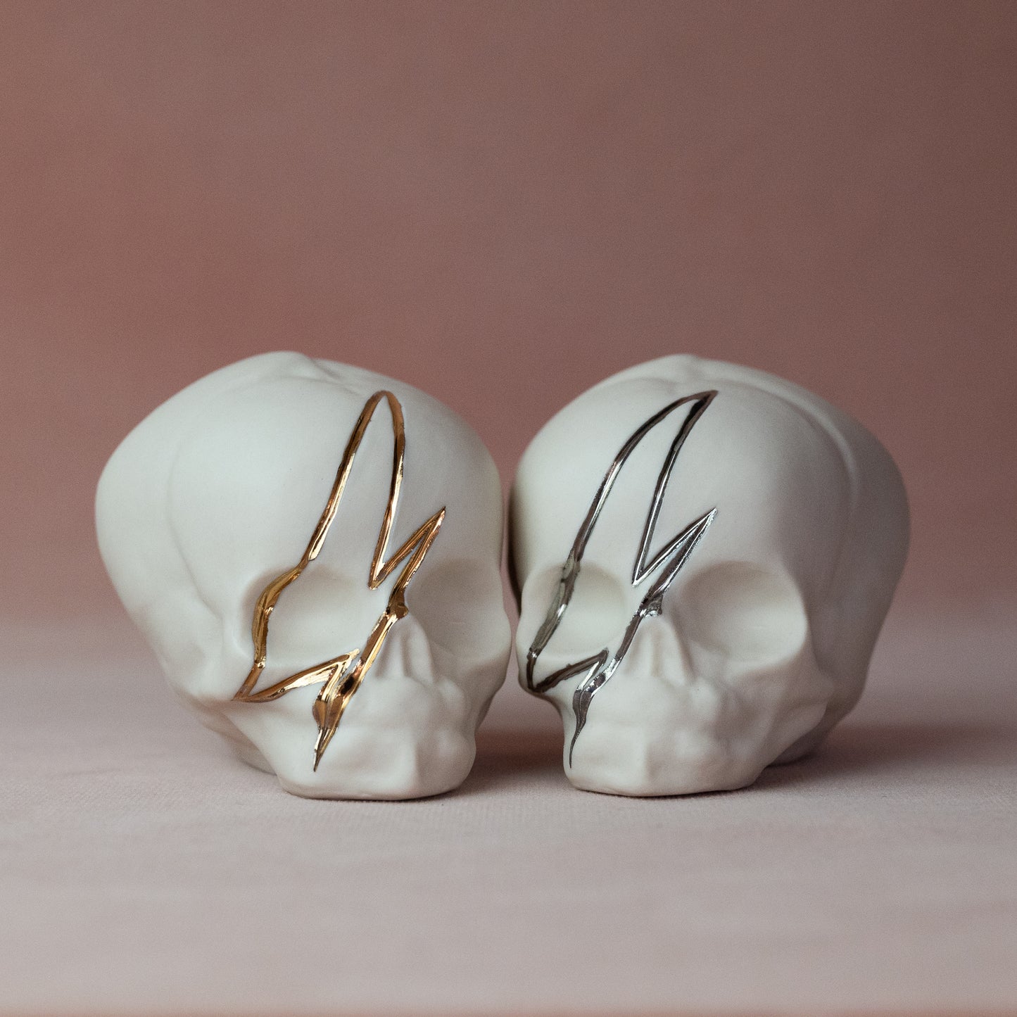 Gilded Porcelain Skull with Lighting Bolt