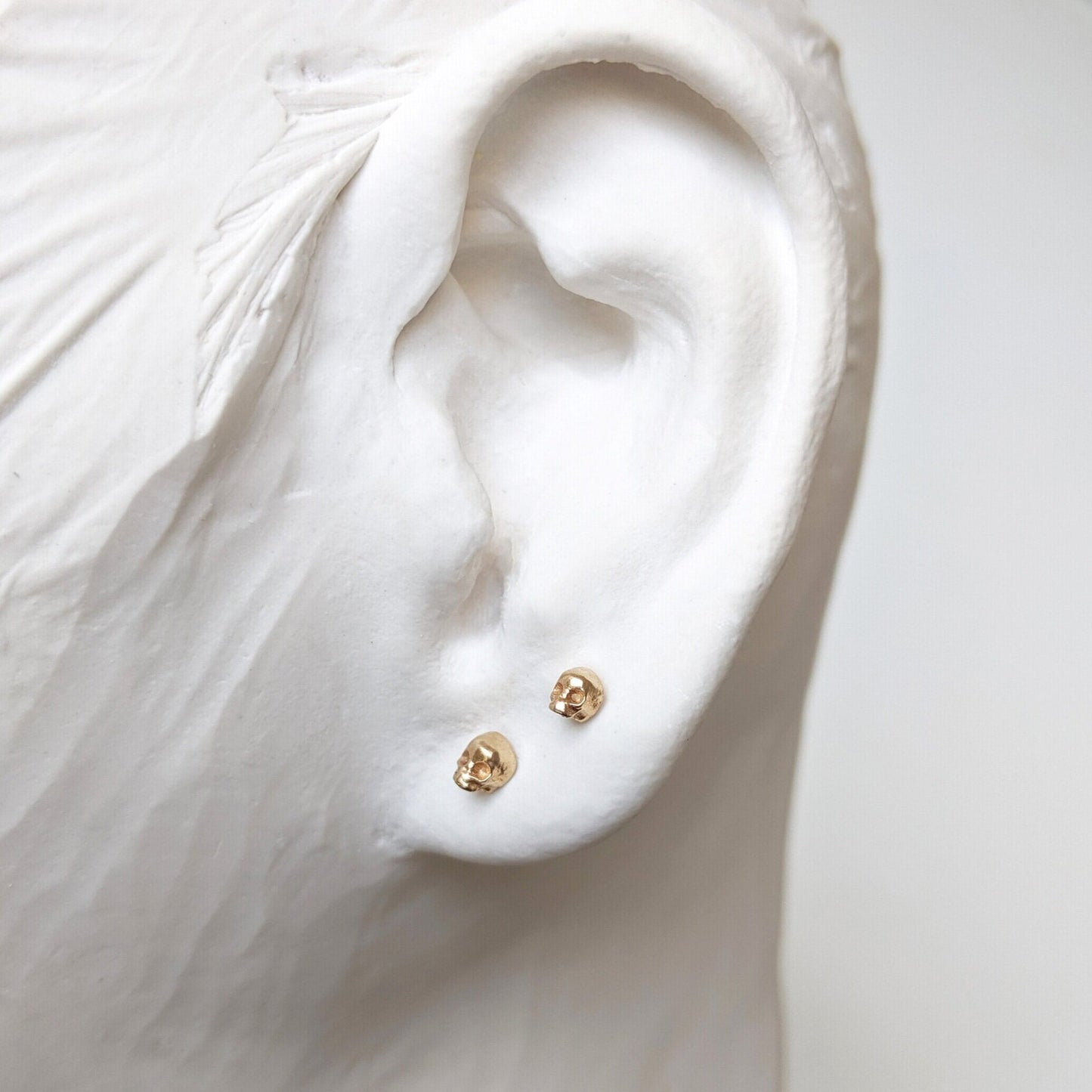 world's tiniest skull earring 14k gold